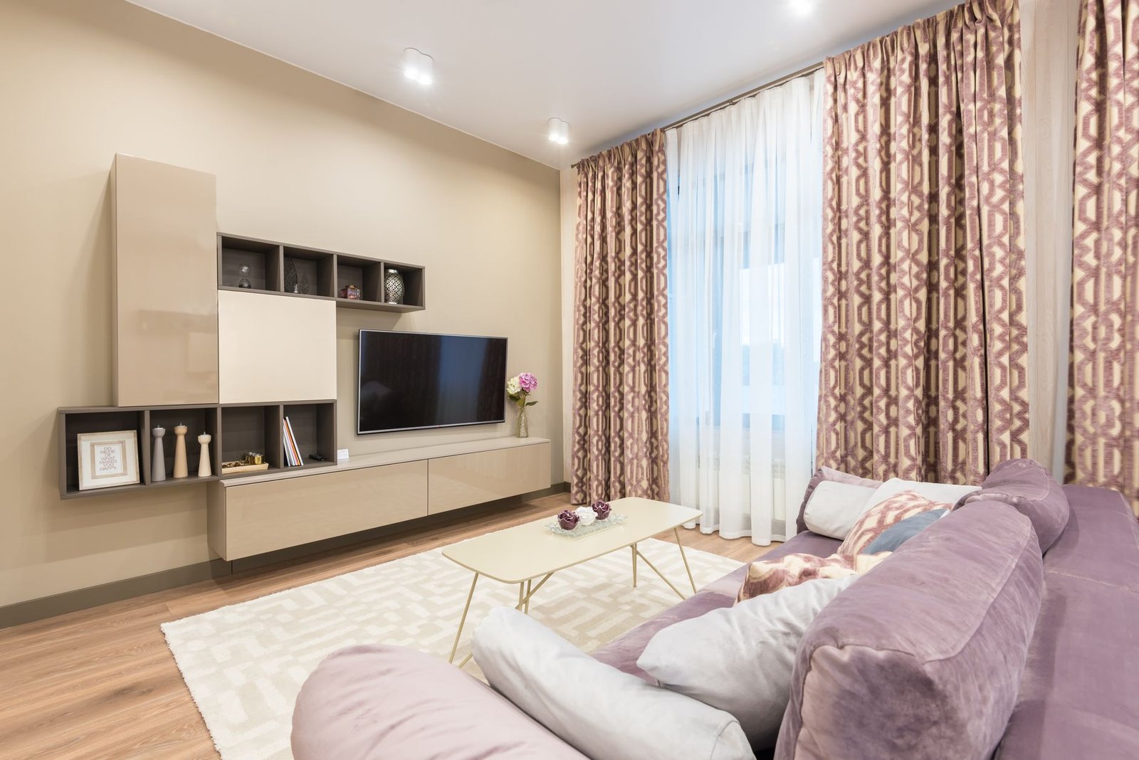 interior of light living room with couch and tv