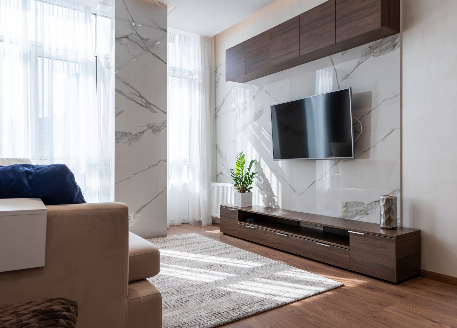 cozy living room interior with wooden furniture and comfy couch