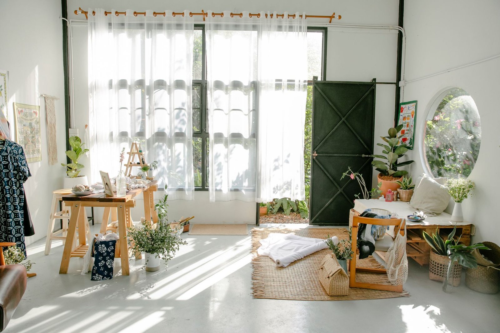 interior of light atelier with minimalist furniture and potted plants